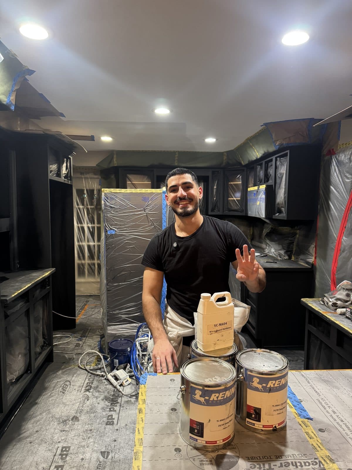 Dark cabinet Renner coating setup Dark kitchen cabinet refinishing setup with Renner coating cans and owner on site
