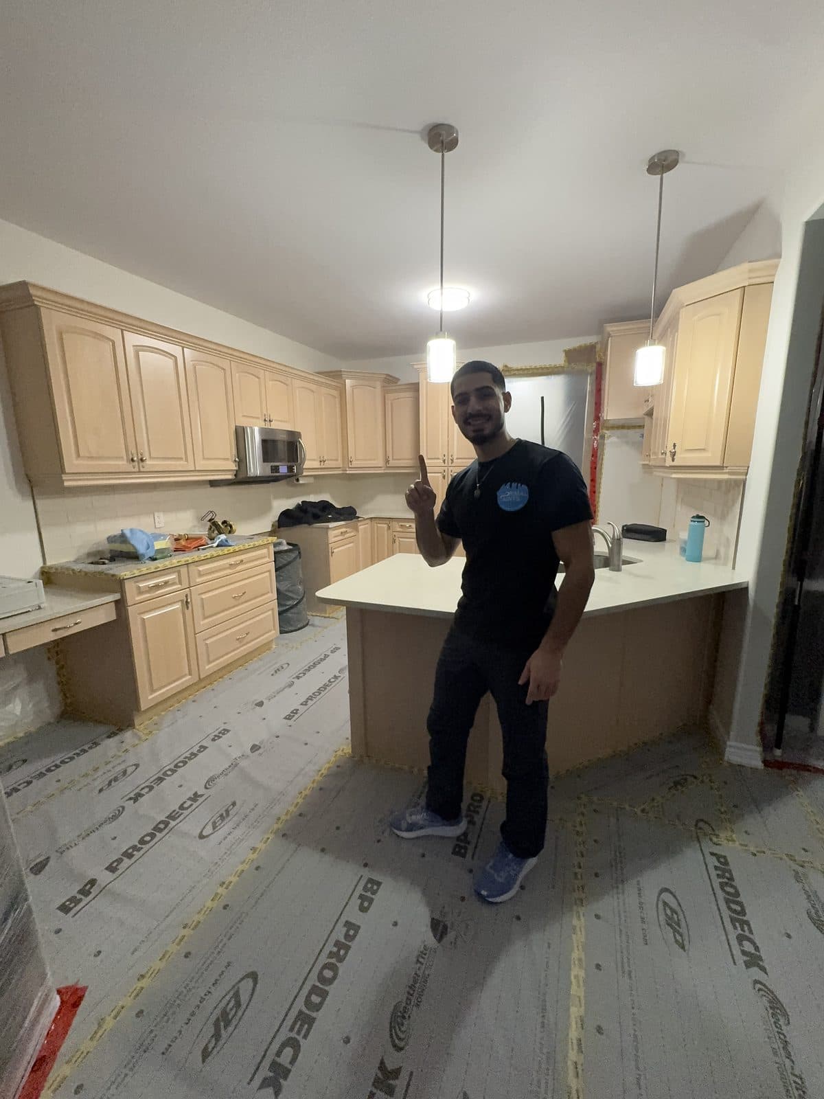 Oak kitchen prep and floor protection Oak kitchen cabinet refinishing prep with full floor protection